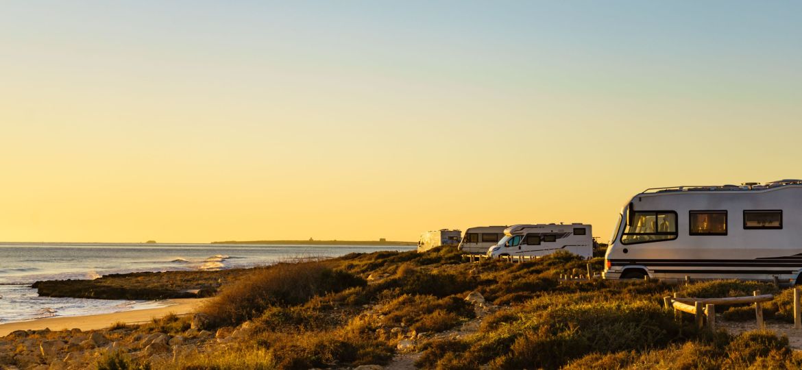 Camper cars on beach sea shore